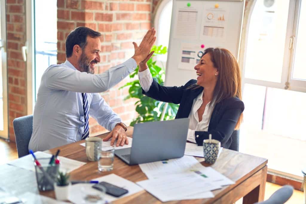 colleagues high fiving